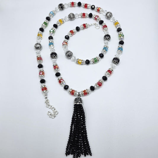 Beaded necklace with a black beaded tassel on a white background