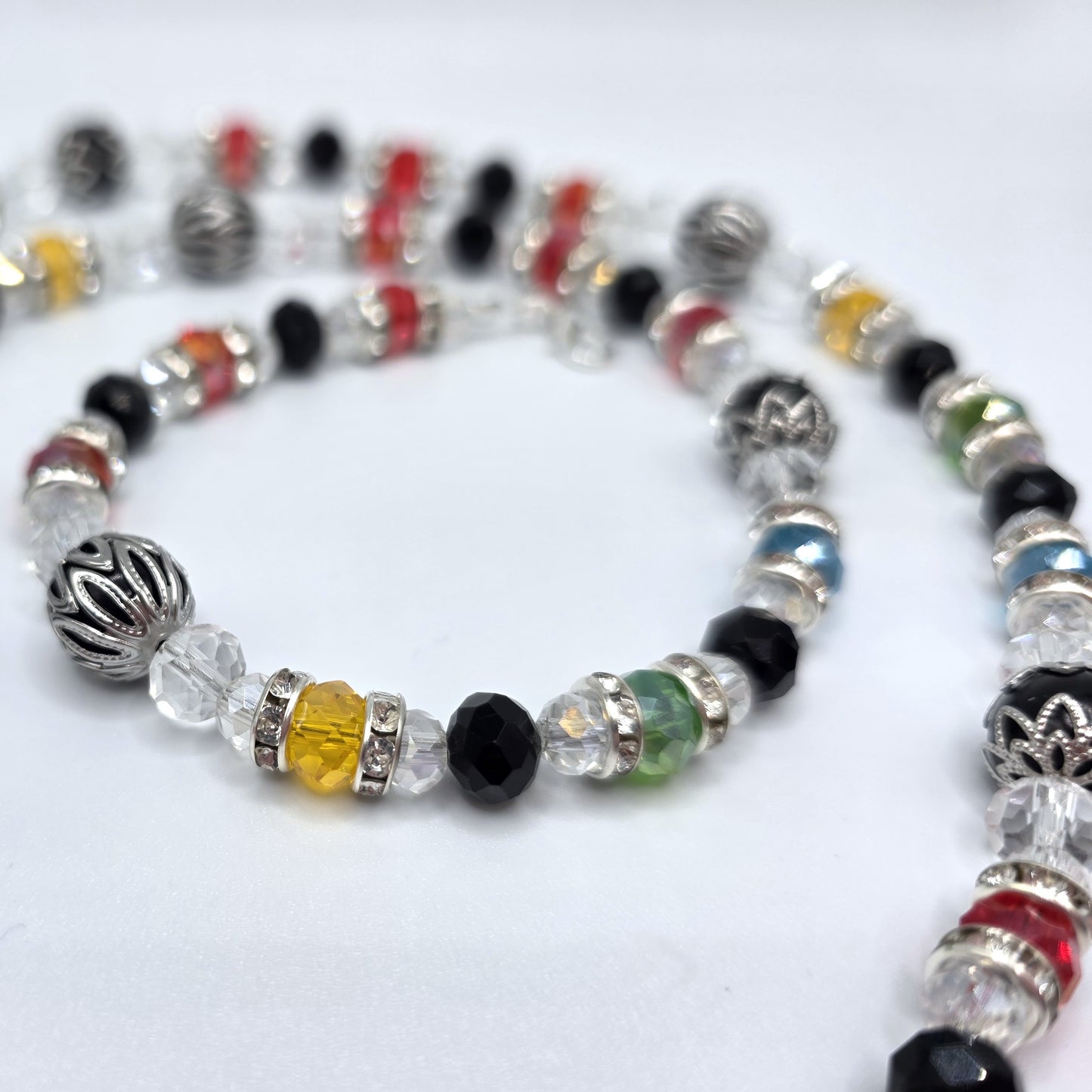 Multicolored beaded necklace on a white background