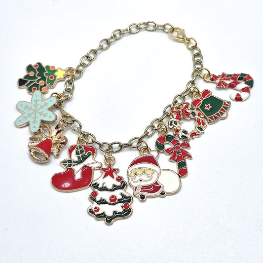 Christmas-themed charm bracelet with various festive charms on a white background