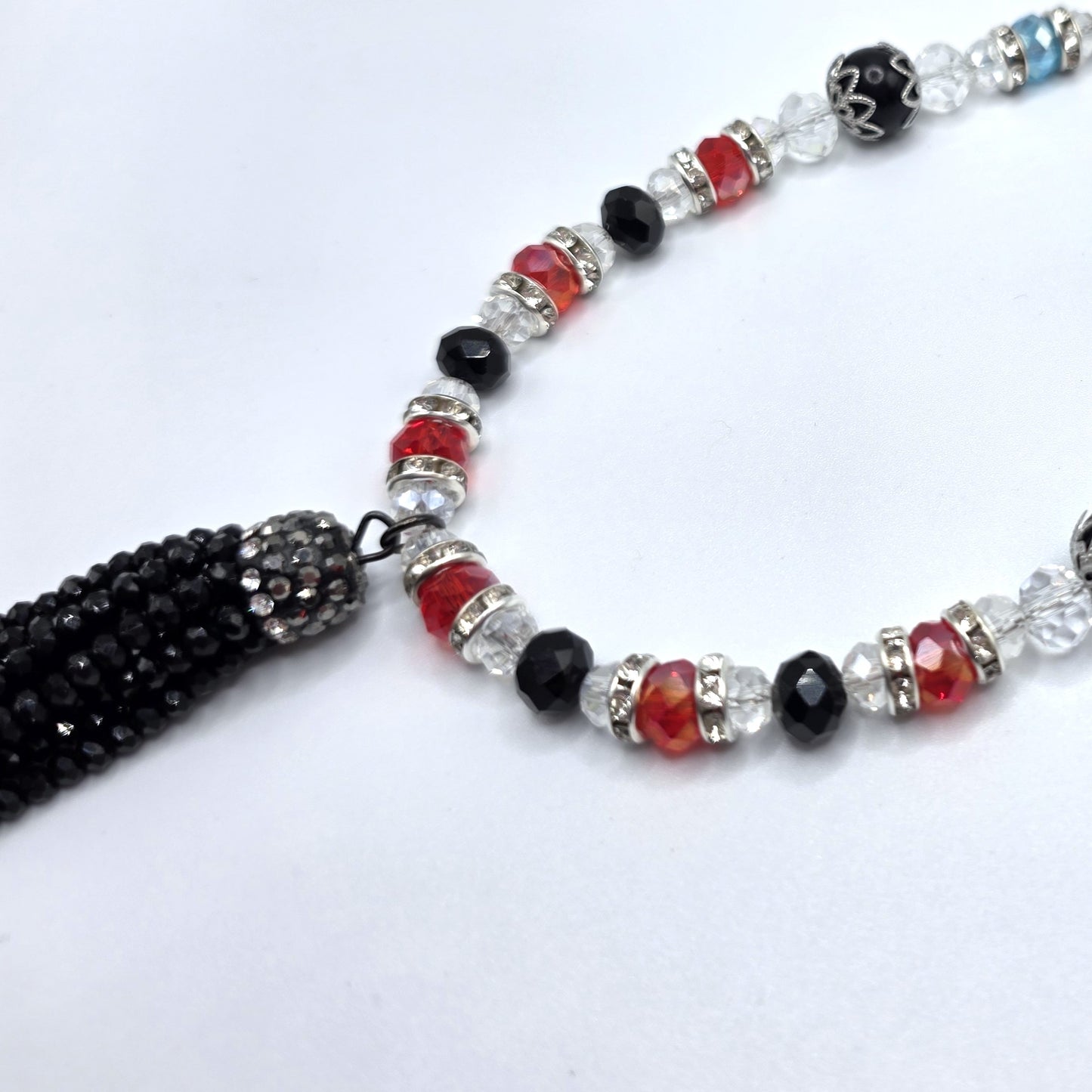 Beaded necklace with multicolor beads on a white background
