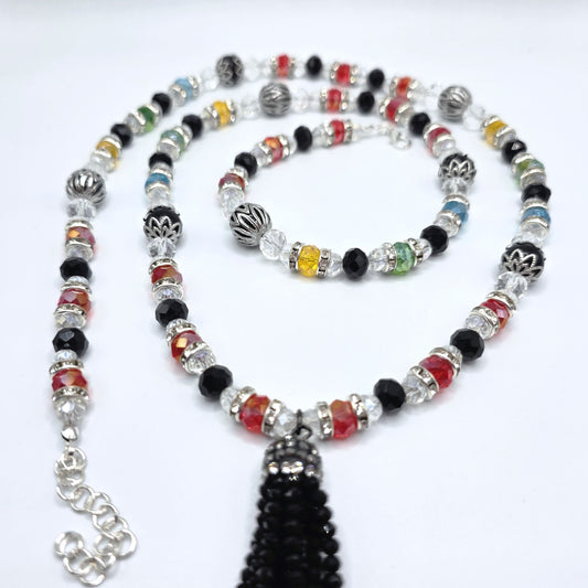 Colorful beaded necklace with a tassel on a white background