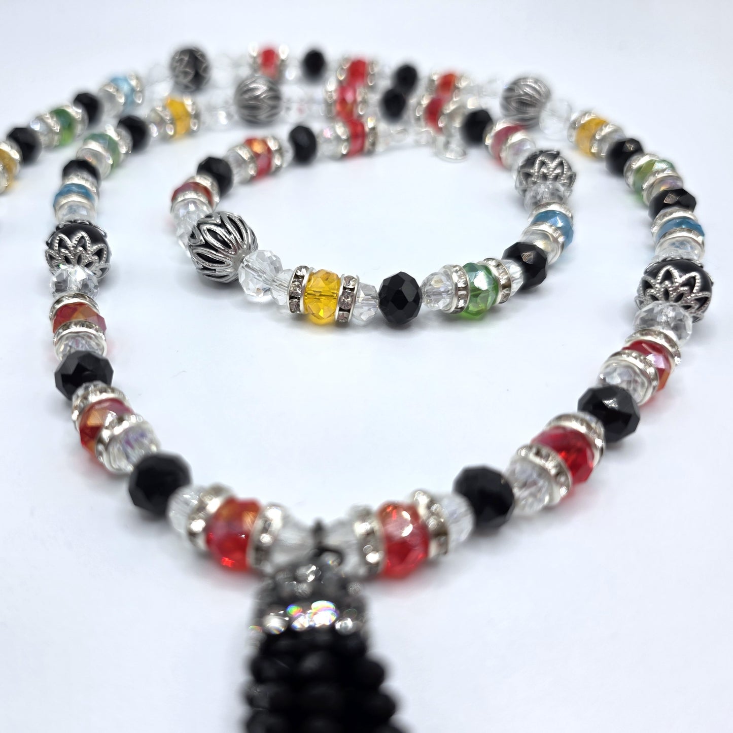 Beaded necklace with colorful beads on a white background
