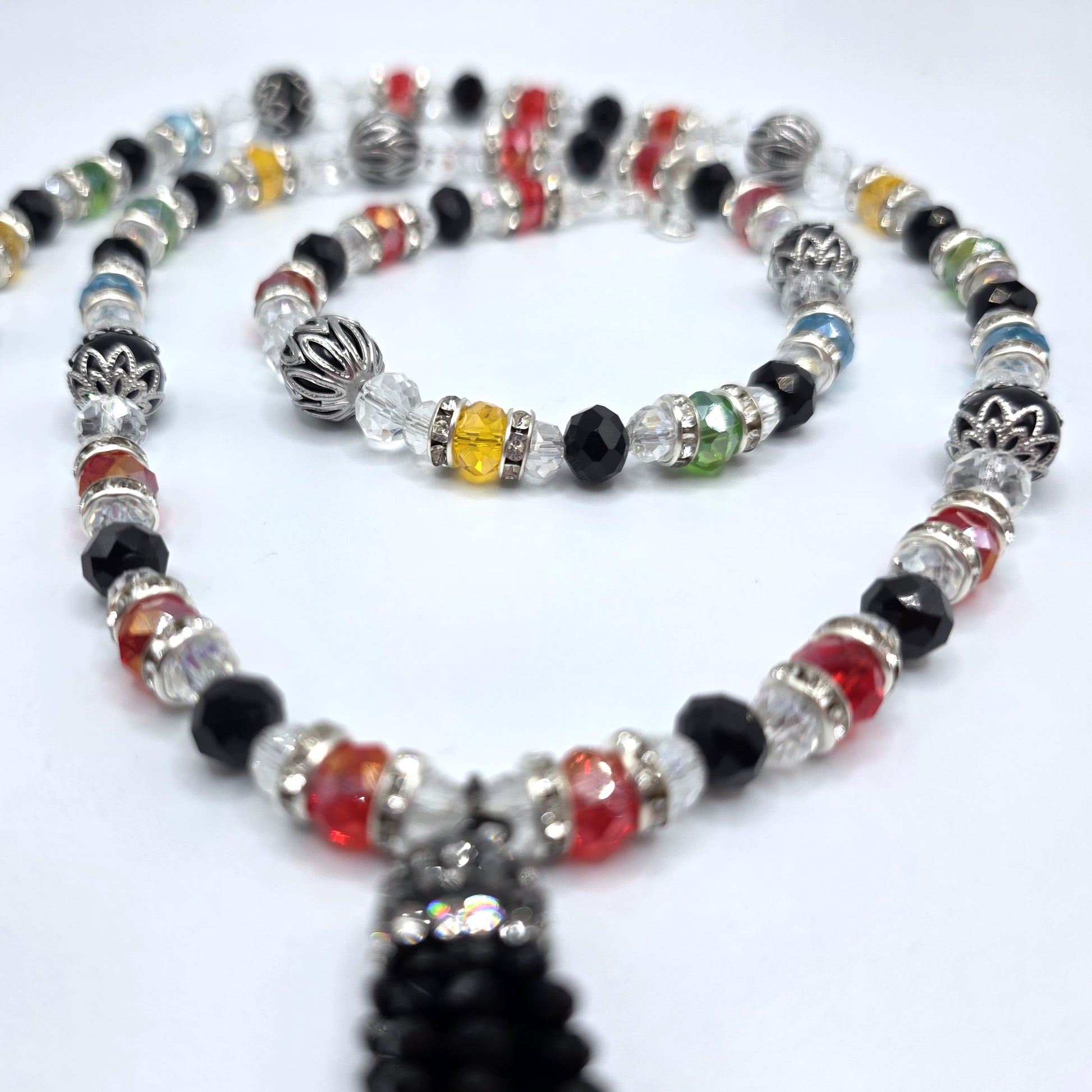 Beaded necklace with colorful beads on a white background