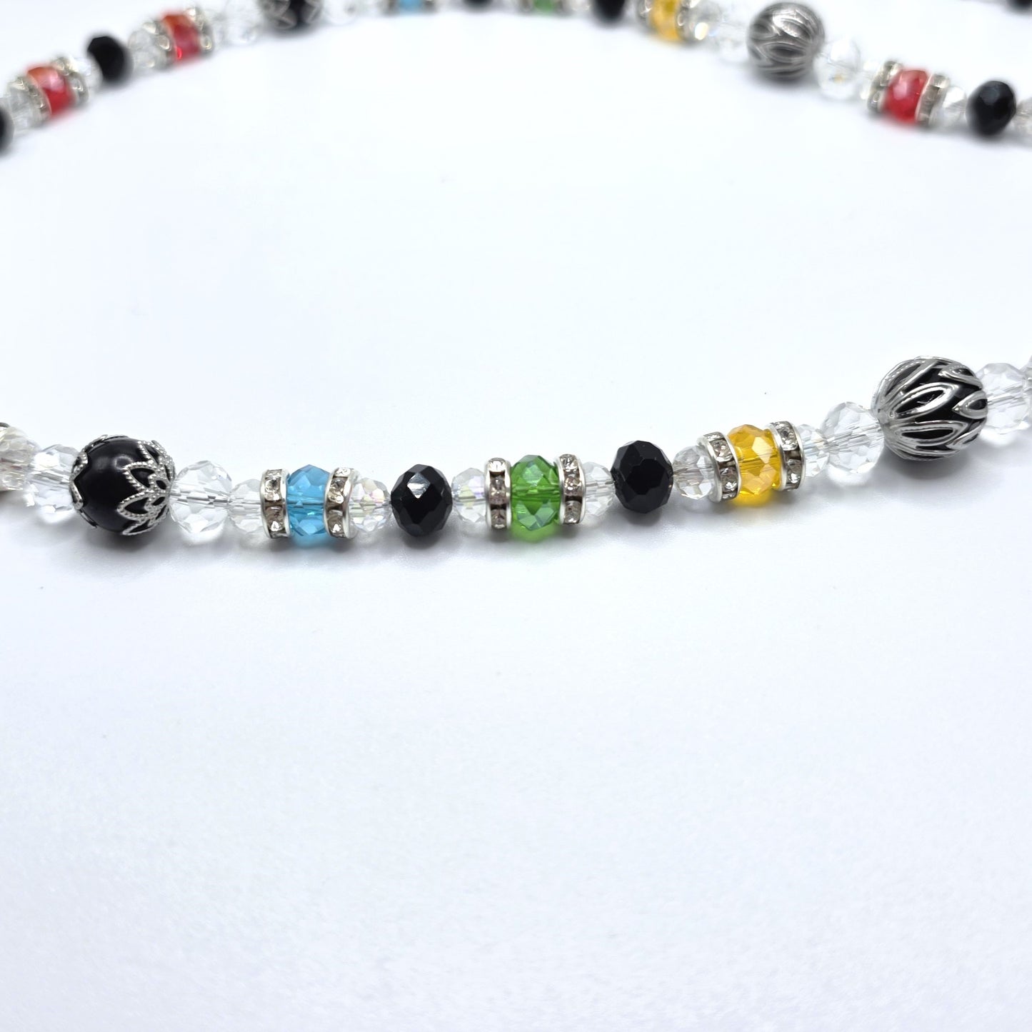Beaded necklace with multicolored beads on a white background