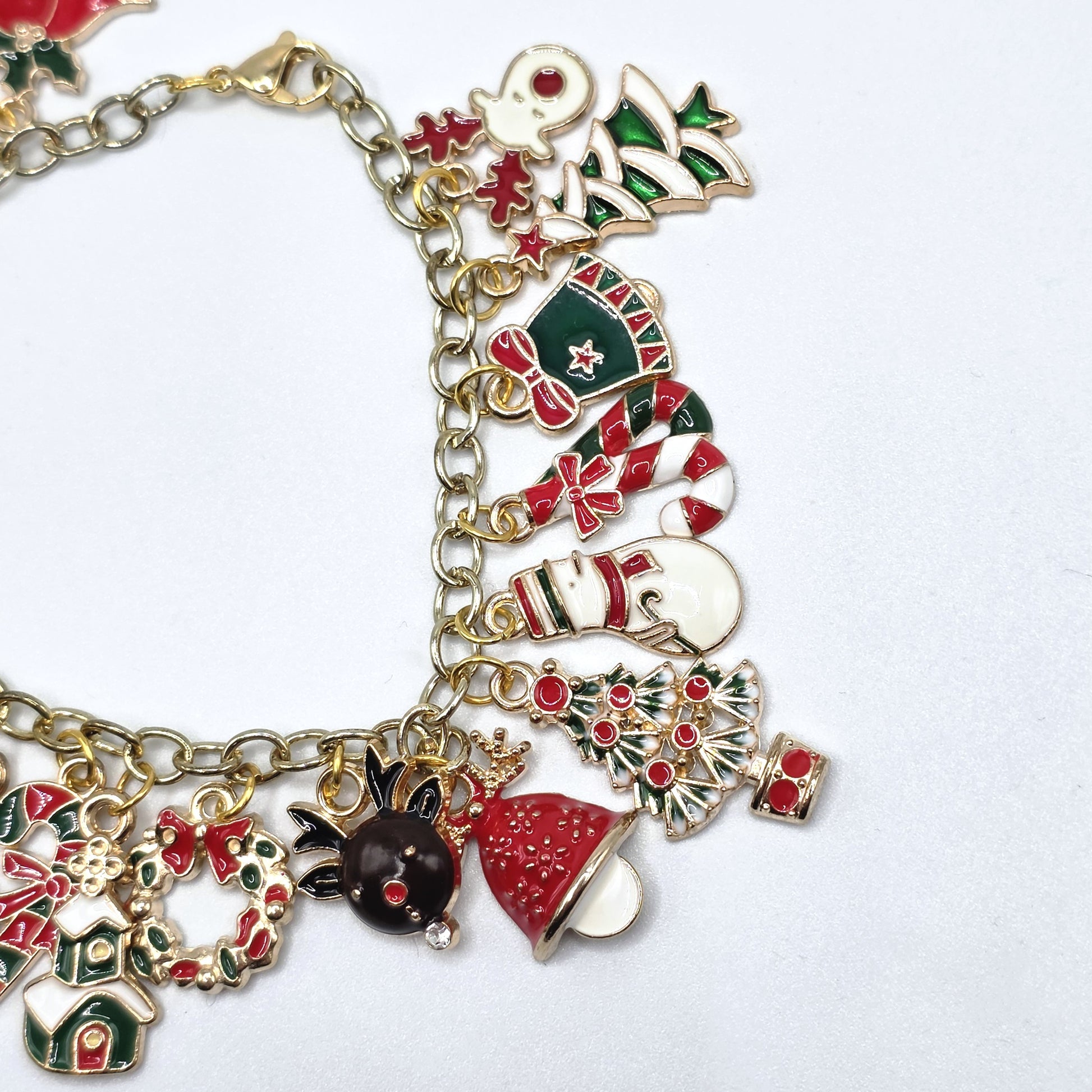 Bracelet with Christmas-themed charms on a white background
