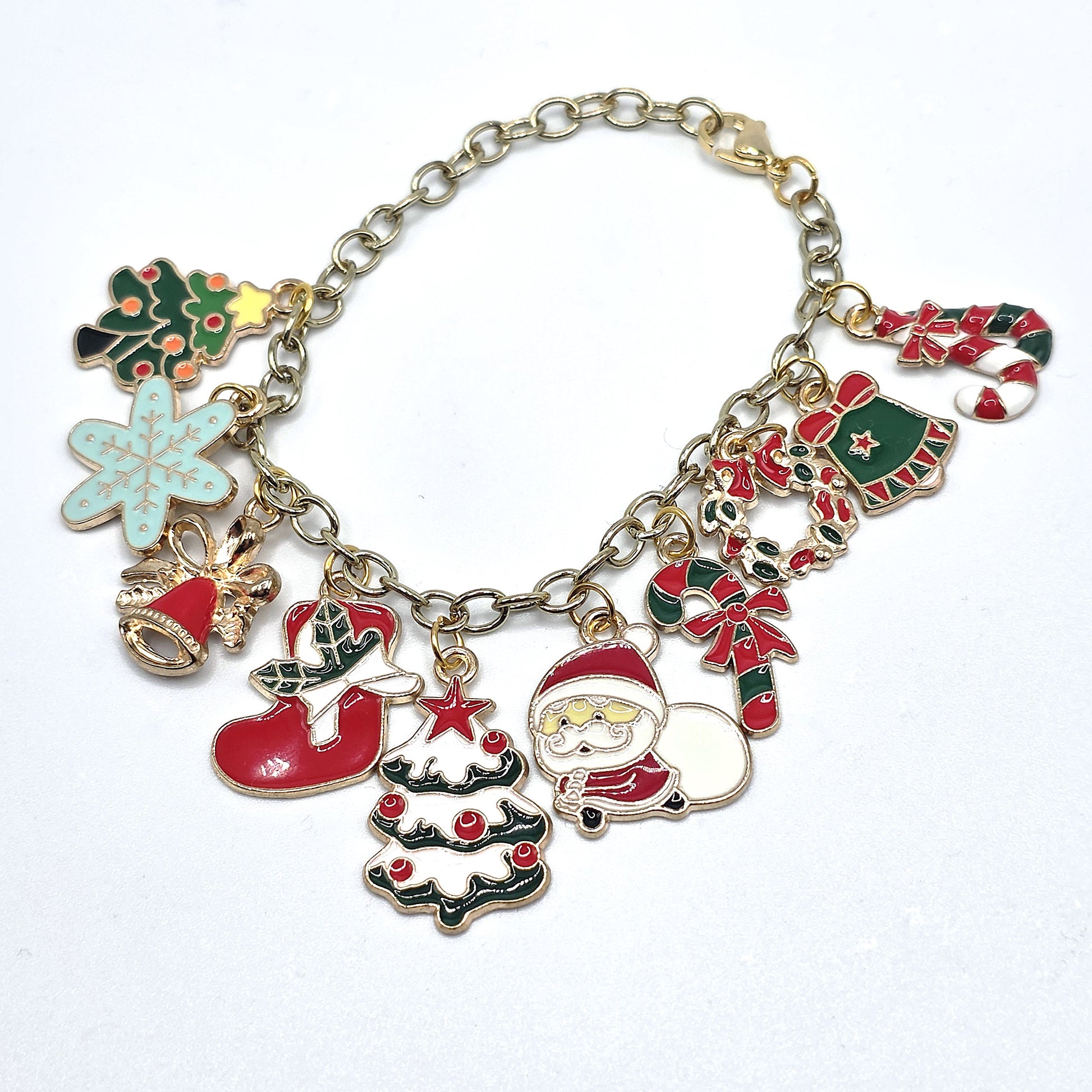 Christmas-themed charm bracelet with various festive charms on a white background