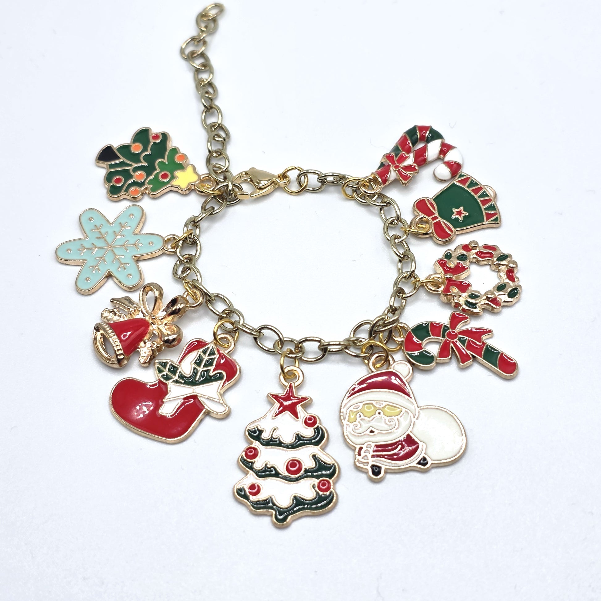 Christmas-themed charm bracelet with various charms on a white background