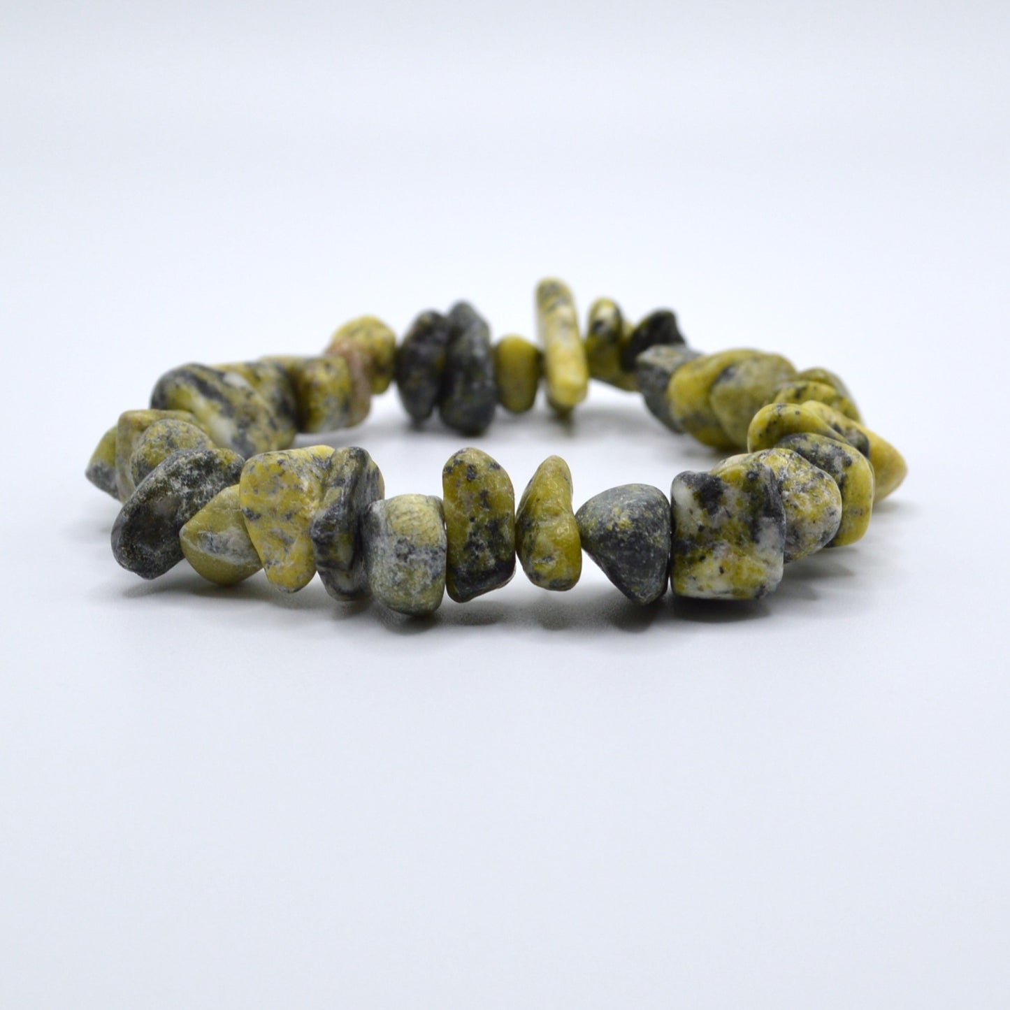 Bracelet with yellow and black beads on a white background