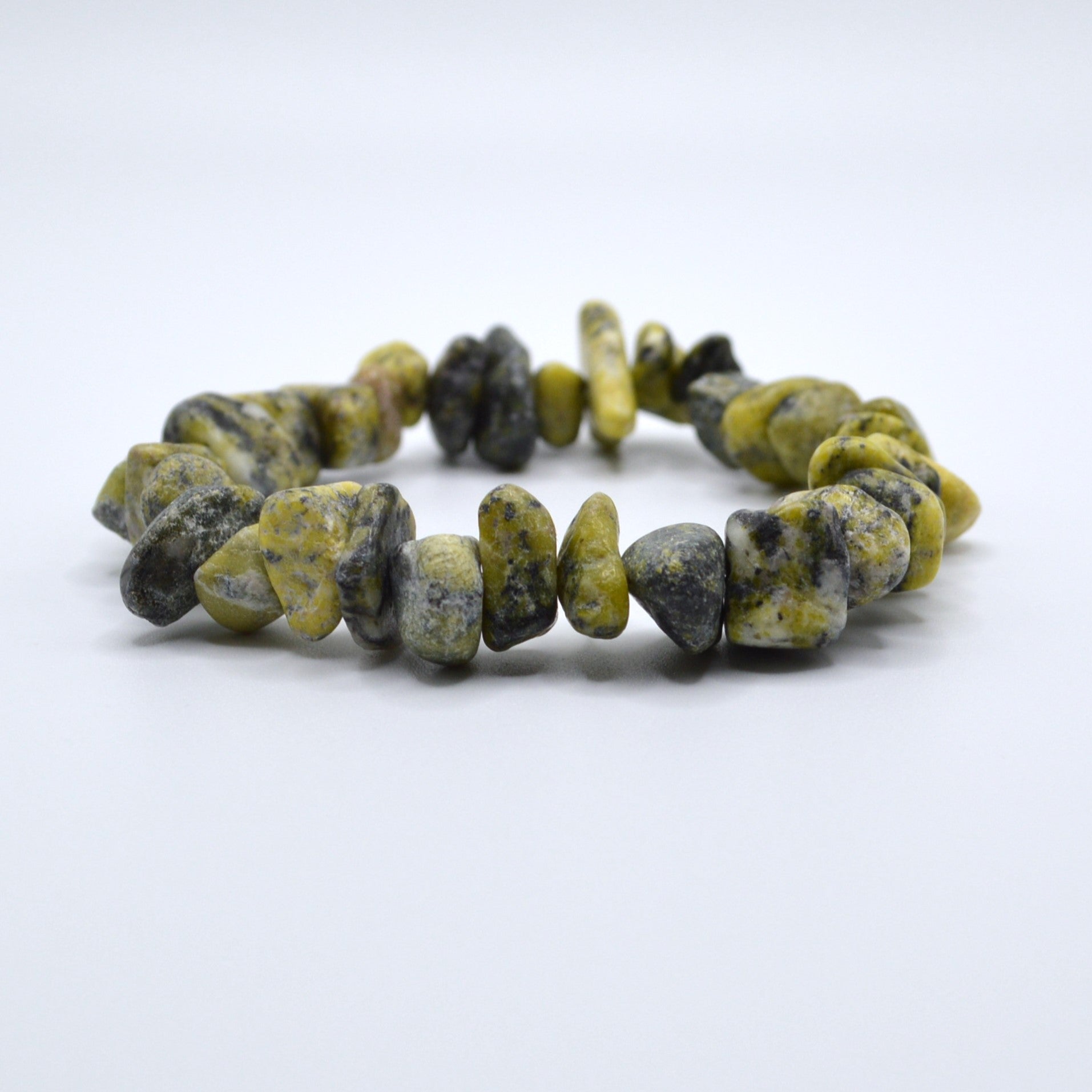 Bracelet with yellow and black beads on a white background