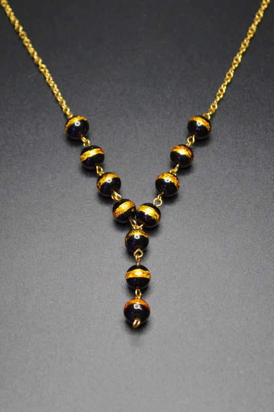 Black with a Gold Stripe Glass Beads on a Gold Chain Necklace